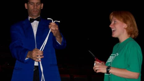 Magician and adult assistant on stage performing the famous rope trick!